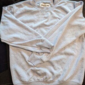 Look effortlessly cool in this breezy sky blue, long-sleeved BoyFriend crewneck!